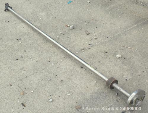 Used Agitator Shaft, 316 Stainless Steel. 1'' Diameter x 62-3/4'' long shaft with a 3'' diameter plastic impeller. 4-3/4'' O.D. (4) 1/2'' diameter hole mounting flange on approximate 2-5/8'' centers