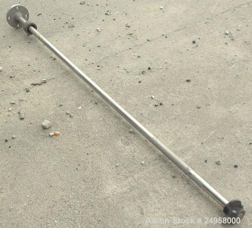 Used Agitator Shaft, 316 Stainless Steel. 1'' Diameter x 62-3/4'' long shaft with a 3'' diameter plastic impeller. 4-3/4'' O.D. (4) 1/2'' diameter hole mounting flange on approximate 2-5/8'' centers