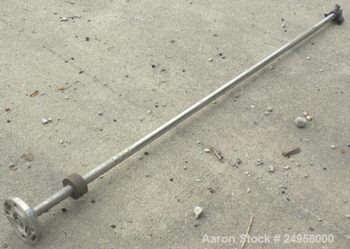 Used Agitator Shaft, 316 Stainless Steel. 1'' Diameter x 62-3/4'' long shaft with a 3'' diameter plastic impeller. 4-3/4'' O.D. (4) 1/2'' diameter hole mounting flange on approximate 2-5/8'' centers