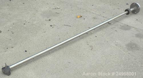 Used Agitator Shaft, 316 Stainless Steel. 1'' Diameter x 62-3/4'' long shaft with a 3'' diameter plastic impeller. 4-3/4'' O.D. (4) 1/2'' diameter hole mounting flange on approximate 2-5/8'' centers