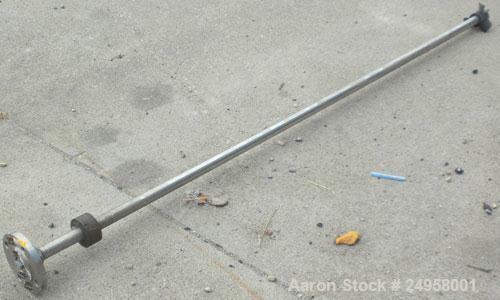 Used Agitator Shaft, 316 Stainless Steel. 1'' Diameter x 62-3/4'' long shaft with a 3'' diameter plastic impeller. 4-3/4'' O.D. (4) 1/2'' diameter hole mounting flange on approximate 2-5/8'' centers