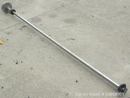Used Agitator Shaft, 316 Stainless Steel. 1'' Diameter x 62-3/4'' long shaft with a 3'' diameter plastic impeller. 4-3/4'' O.D. (4) 1/2'' diameter hole mounting flange on approximate 2-5/8'' centers