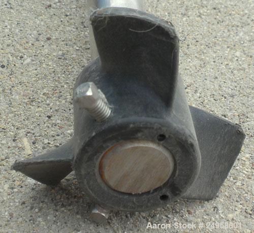 Used Agitator Shaft, 316 Stainless Steel. 1'' Diameter x 62-3/4'' long shaft with a 3'' diameter plastic impeller. 4-3/4'' O.D. (4) 1/2'' diameter hole mounting flange on approximate 2-5/8'' centers