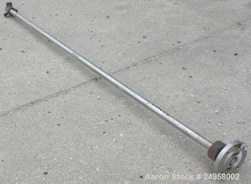 Used Agitator Shaft, 316 Stainless Steel. 1'' Diameter x 62-3/4'' long shaft with a 3'' diameter plastic impeller. 4-3/4'' O.D. (4) 1/2'' diameter hole mounting flange on approximate 2-5/8'' centers