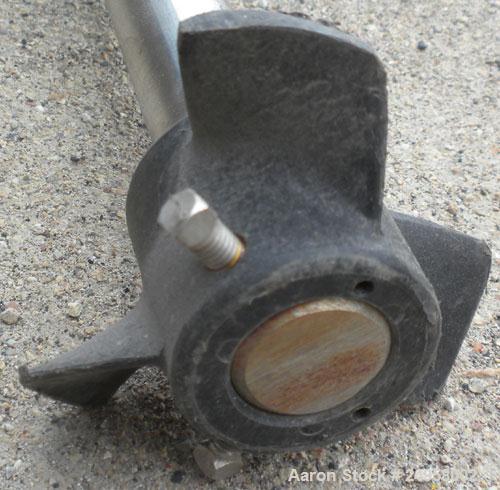 Used Agitator Shaft, 316 Stainless Steel. 1'' Diameter x 62-3/4'' long shaft with a 3'' diameter plastic impeller. 4-3/4'' O.D. (4) 1/2'' diameter hole mounting flange on approximate 2-5/8'' centers