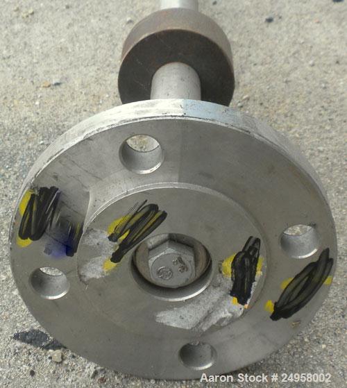 Used Agitator Shaft, 316 Stainless Steel. 1'' Diameter x 62-3/4'' long shaft with a 3'' diameter plastic impeller. 4-3/4'' O.D. (4) 1/2'' diameter hole mounting flange on approximate 2-5/8'' centers