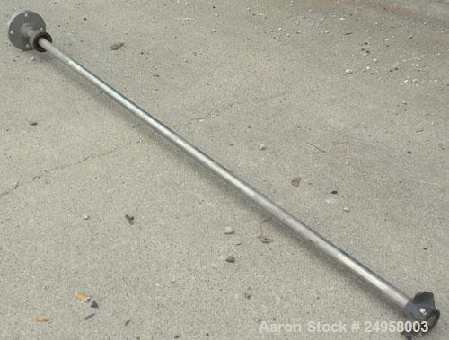 Used Agitator Shaft, 316 Stainless Steel. 1'' Diameter x 62-3/4'' long shaft with a 3'' diameter plastic impeller. 4-3/4'' O.D. (4) 1/2'' diameter hole mounting flange on approximate 2-5/8'' centers
