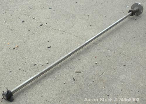 Used Agitator Shaft, 316 Stainless Steel. 1'' Diameter x 62-3/4'' long shaft with a 3'' diameter plastic impeller. 4-3/4'' O.D. (4) 1/2'' diameter hole mounting flange on approximate 2-5/8'' centers