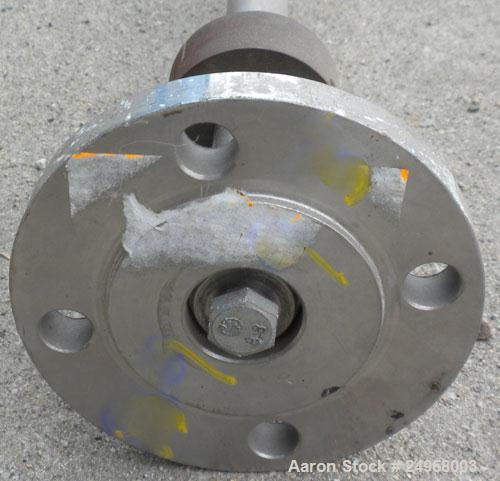 Used Agitator Shaft, 316 Stainless Steel. 1'' Diameter x 62-3/4'' long shaft with a 3'' diameter plastic impeller. 4-3/4'' O.D. (4) 1/2'' diameter hole mounting flange on approximate 2-5/8'' centers