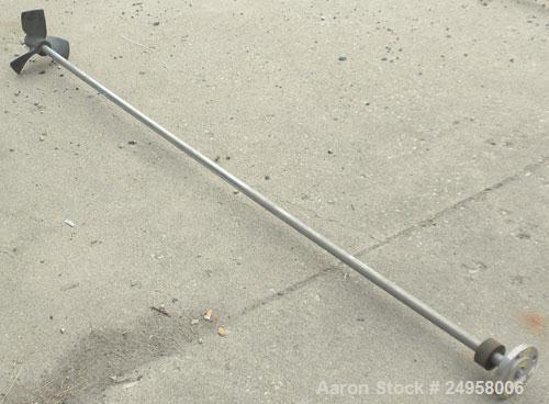Used Agitator Shaft, 316 Stainless Steel. 1" Diameter x 83" long shaft with a 10" diameter plastic impeller. 4-3/4" O.D. (4) 1/2" diameter hole mounting flange on approximate 2-5/8" centers