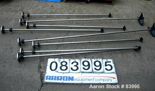 Used Agitator Shaft, 316 Stainless Steel.  1" diameter x 83" long with 10" diameter plastic impeller. 4-3/4" OD. 4 hole mounting flange.