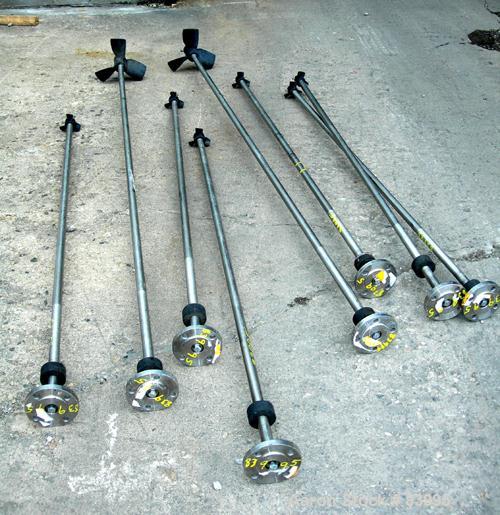 Used Agitator Shaft, 316 Stainless Steel.  1" diameter x 83" long with 10" diameter plastic impeller. 4-3/4" OD. 4 hole mounting flange.