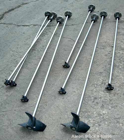 Used Agitator Shaft, 316 Stainless Steel.  1" diameter x 83" long with 10" diameter plastic impeller. 4-3/4" OD. 4 hole mounting flange.