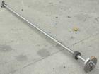 Used Agitator Shaft, 316 Stainless Steel. 1'' Diameter x 62-3/4'' long shaft with a 3'' diameter plastic impeller. 4-3/4'' O.D. (4) 1/2'' diameter hole mounting flange on approximate 2-5/8'' centers