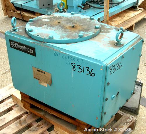 Used Chemineer Agitator Gearbox Only, Model 6HTM15. Input rpm 900, output rpm 30. Approximate 9-3/8" OD carbon steel shaft mounting ring with (6) approximate 3/4" threaded holes on 4" centers. Unit r...