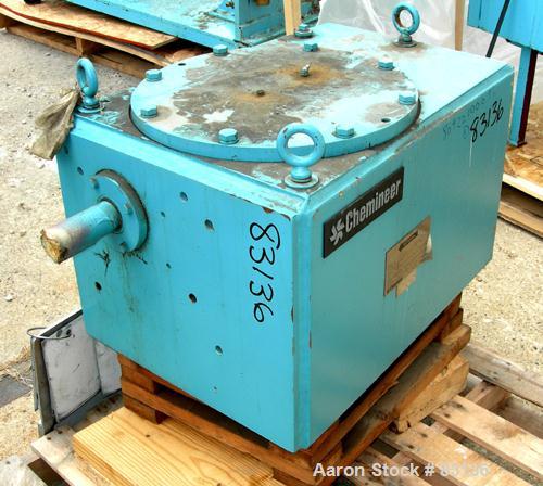 Used Chemineer Agitator Gearbox Only, Model 6HTM15. Input rpm 900, output rpm 30. Approximate 9-3/8" OD carbon steel shaft mounting ring with (6) approximate 3/4" threaded holes on 4" centers. Unit r...