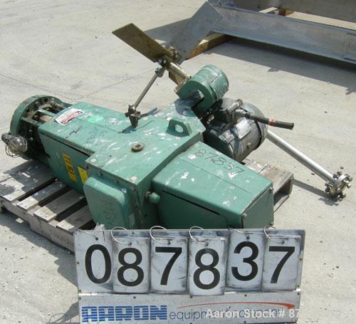 Used Lightnin agitator, model 82S5MX, ratio 21.1, output 84 rpm. 2" diameter 316 stainless steel shaft with a 32" diameter span 316 stainless steel 4 blade turbine, driven by a 5 hp, 3/60/230/460 vol...