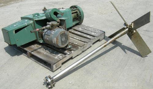 Used Lightnin agitator, model 82S5MX, ratio 21.1, output 84 rpm. 2" diameter 316 stainless steel shaft with a 32" diameter span 316 stainless steel 4 blade turbine, driven by a 5 hp, 3/60/230/460 vol...