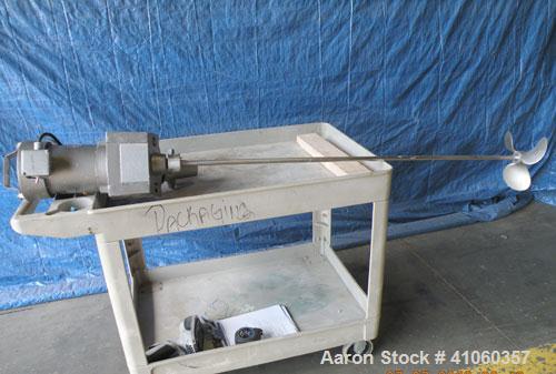Used Lightnin Clamp-On Agitator, Model ND-1. 5/8" diameter x 50" long 304 stainless steel shaft with a 9" diameter 316 stainless steel 3 blade prop. Driven by a 1/3 hp, 1/60/115 volt, 1725 rpm motor.
