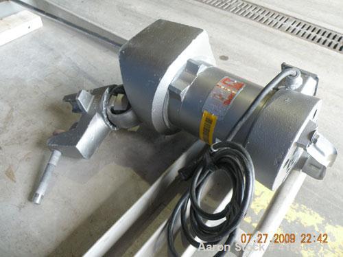 Used Lightnin Clamp-On Agitator, Model ND-1. 5/8" diameter x 50" long 304 stainless steel shaft with a 9" diameter 316 stainless steel 3 blade prop. Driven by a 1/3 hp, 1/60/115 volt, 1725 rpm motor.