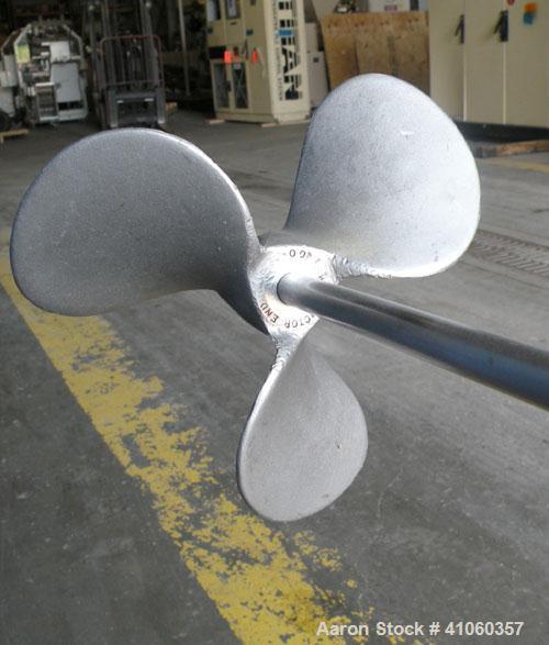 Used Lightnin Clamp-On Agitator, Model ND-1. 5/8" diameter x 50" long 304 stainless steel shaft with a 9" diameter 316 stainless steel 3 blade prop. Driven by a 1/3 hp, 1/60/115 volt, 1725 rpm motor.