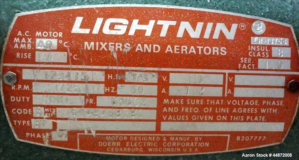 Used Lightnin agitator, Model NS-1. Approximately 1/2" diameter shaft with a 3 blade turbine, driven by a 0.33 hp, 1/60/115 volt, 1725 rpm motor. Clamp on. Serial #7902195.