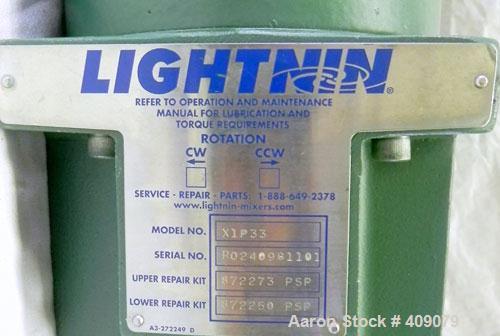 Used Lightnin Clamp-On Agitator, Model X1P33.  1-1/2" Diameter x 18" long 316 stainless steel shaft with a 3 blade prop.  Driven by a 1/2 hp, 3/60/230/460 volt, 1725 rpm motor.  Includes a Lightnin i...
