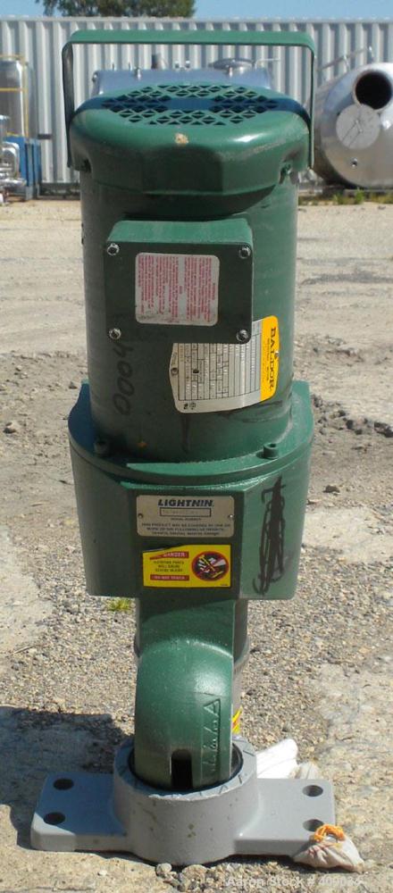 Used Lightnin Top Entering Agitator, Model X5P75. Cup plate mounting. Driven by a 3/4hp, 3/60/230/460 volt, 1725 rpm motor. Set fo clockwise rotation, requires shaft.