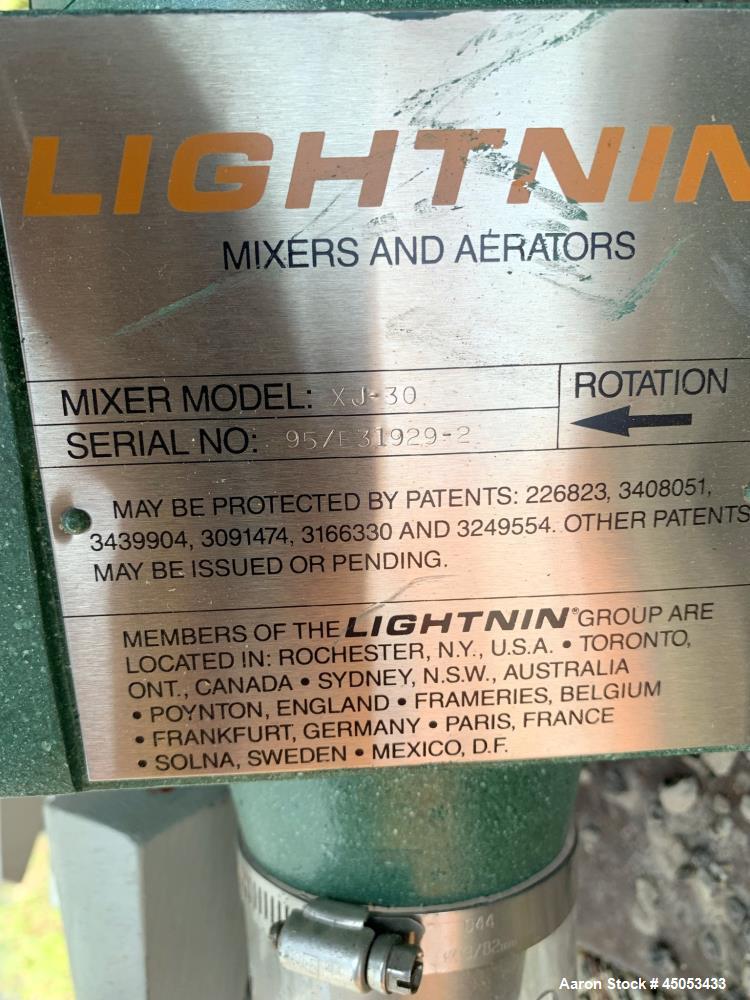 Unused- Lightnin Agitator, Model XJ-30. Approximate 5/8" diameter x 24" long stainless steel shaft with 3-blade turbine. Driven by 0.30hp, 3/60/50/208-220/440 volt, 1725/1450 rpm motor. Serial# 95/31...