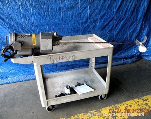 Used Lightnin Clamp-On Agitator, Model XJ-43. 5/8" diameter x 47-1/2" long 316 stainless steel shaft with a 9" diameter 316 stainless steel 3 blade prop. Driven by a 0.43 hp, 1/60/115/230 volt, 1725/...
