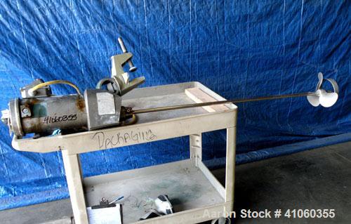 Used Lightnin Clamp-On Agitator, Model XJ-75VM. 3/4" diameter x 50" long 316 stainless steel shaft with a 8-1/2" diameter 316 stainless steel 3 blade prop. Driven by a 3/4 hp, 180 volt, 1750 rpm moto...