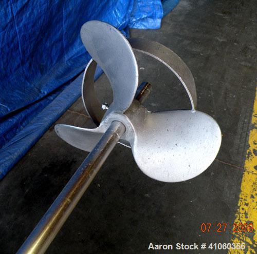 Used Lightnin Clamp-On Agitator, Model XJ-75VM. 3/4" diameter x 50" long 316 stainless steel shaft with a 8-1/2" diameter 316 stainless steel 3 blade prop. Driven by a 3/4 hp, 180 volt, 1750 rpm moto...