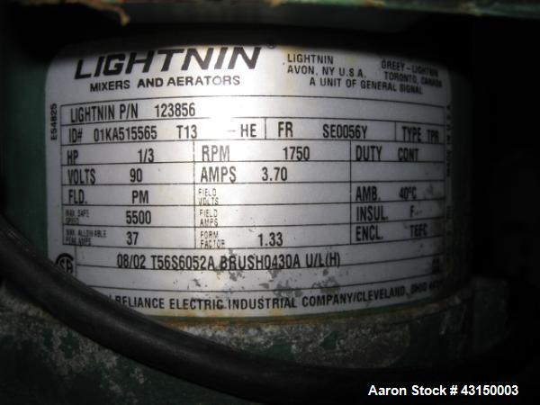 Used Lightnin Clamp Mount Agitator, Model XJ30VM. 32" Long stainless steel shaft, 9" propeller type blade, 1/3 HP 90 volt DC motor, with stand, serial# 9893B477C1.