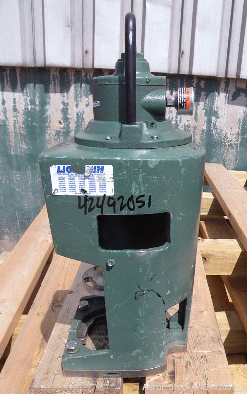 Used Lightnin Fixed Mount, Open Tank Design, Air Operated Agitator, Model XJACK-100. Clockwise rotation. Approximate 4’’ diameter 304 stainless steel stub shaft mounting flange with slotted bolt hole...