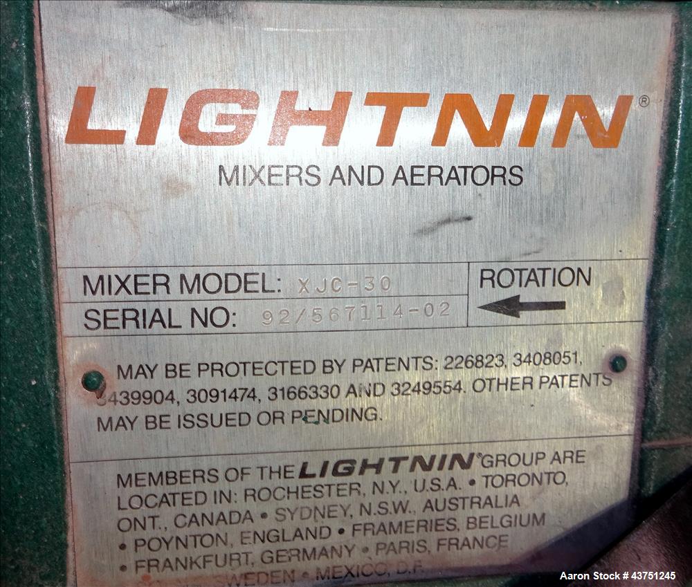 Used Lightnin Agitator, Model XJC-30. 1" Diameter x 28" long stainless steel shaft with a 3 blade turbine, driven by a 0.30hp, 3/60/208-230/460 volt, 1725/1450 rpm motor. Serial# 92/567114-02.