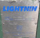 Used Lightnin Fixed Mount, Open Tank Design, Air Operated Agitator, Model XJACK-100. Clockwise rotation. Approximate 4’’ diameter 304 stainless steel stub shaft mounting flange with slotted bolt hole...