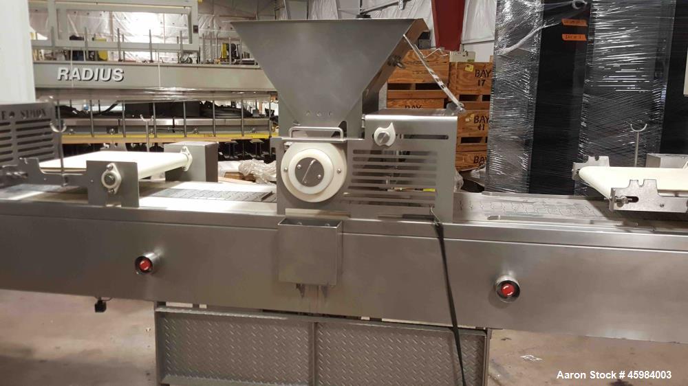 Used- Simple Simon Pie Machine, Model 4700. Capable of producing pies ranging from 25 -1000 grams in volume with any type of...
