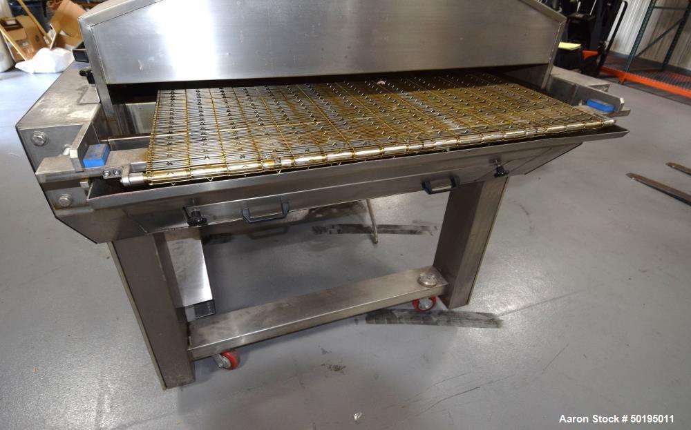 Used Oil Spray Coating Machine. Includes wire mesh belt conveyor, spray applicators and oil recirculation unit. Mounted on casters.  ADD 18% BP AND $500 LOADING FEE.