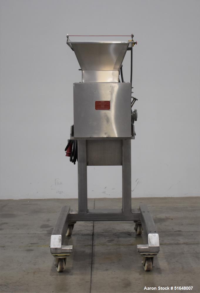 Used Dough 3 Roll Extruder / Pre-Sheeter. Approximate 24" wide rolls. (2) Smooth rolls, (1) grooved roll. Grooved roll driven by a 5hp gear motor, 23.6 output rpm. Top inlet hopper, no cover. Control...