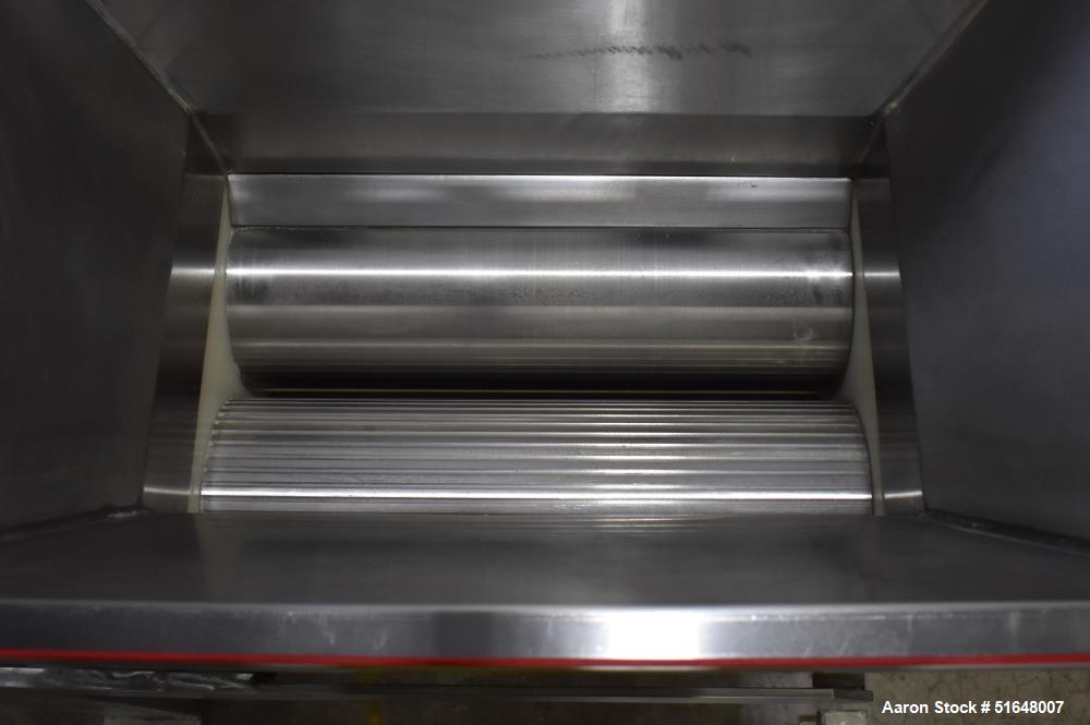 Used Dough 3 Roll Extruder / Pre-Sheeter. Approximate 24" wide rolls. (2) Smooth rolls, (1) grooved roll. Grooved roll driven by a 5hp gear motor, 23.6 output rpm. Top inlet hopper, no cover. Control...