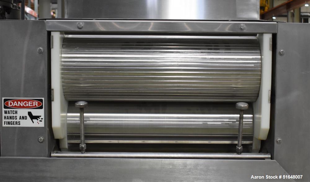 Used Dough 3 Roll Extruder / Pre-Sheeter. Approximate 24" wide rolls. (2) Smooth rolls, (1) grooved roll. Grooved roll driven by a 5hp gear motor, 23.6 output rpm. Top inlet hopper, no cover. Control...