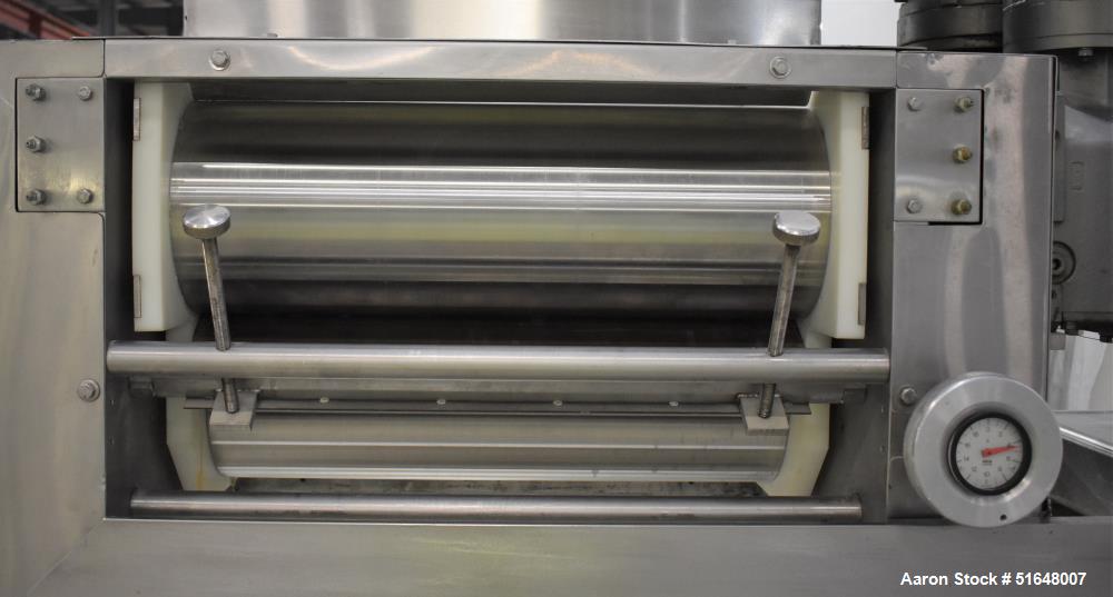 Used Dough 3 Roll Extruder / Pre-Sheeter. Approximate 24" wide rolls. (2) Smooth rolls, (1) grooved roll. Grooved roll driven by a 5hp gear motor, 23.6 output rpm. Top inlet hopper, no cover. Control...