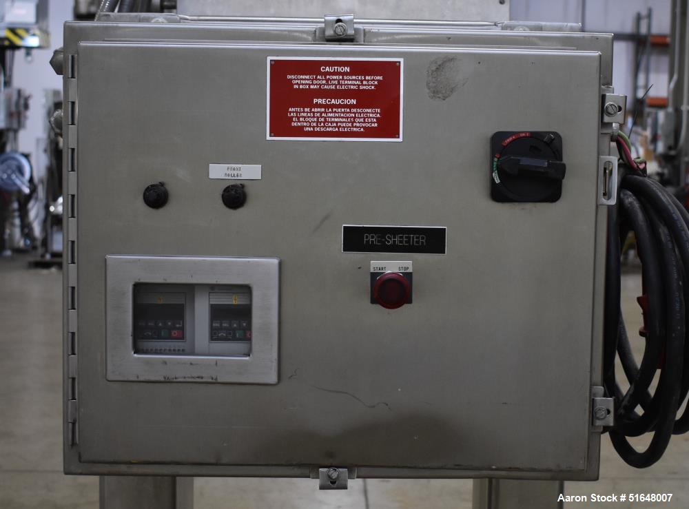 Used Dough 3 Roll Extruder / Pre-Sheeter. Approximate 24" wide rolls. (2) Smooth rolls, (1) grooved roll. Grooved roll driven by a 5hp gear motor, 23.6 output rpm. Top inlet hopper, no cover. Control...