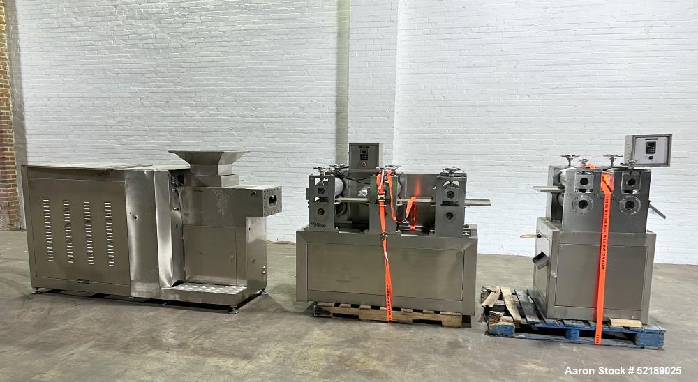 Used Shangha Target 11" Rolling & Scoring Line. Designed to make chiclets. Consisting of: Twin Screw extruder missing screws and die with motor drive, (3) sets of sheeting rollers measuring approxima...