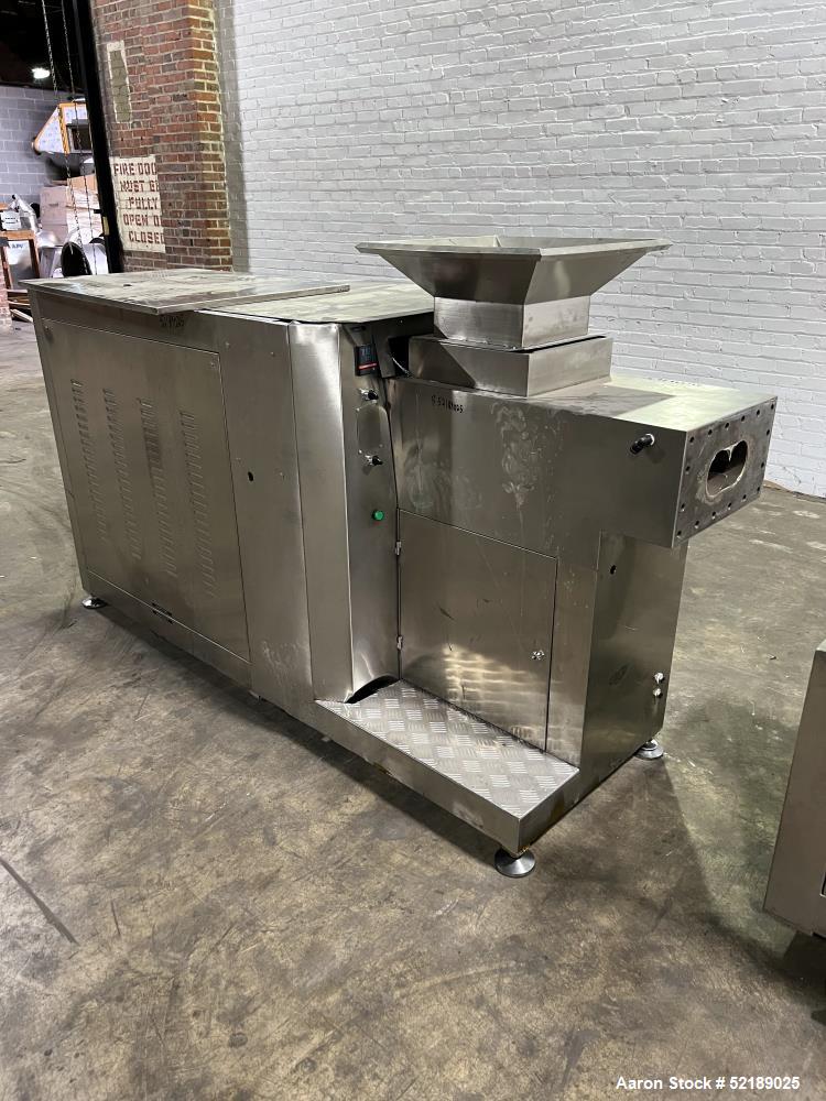 Used Shangha Target 11" Rolling & Scoring Line. Designed to make chiclets. Consisting of: Twin Screw extruder missing screws and die with motor drive, (3) sets of sheeting rollers measuring approxima...