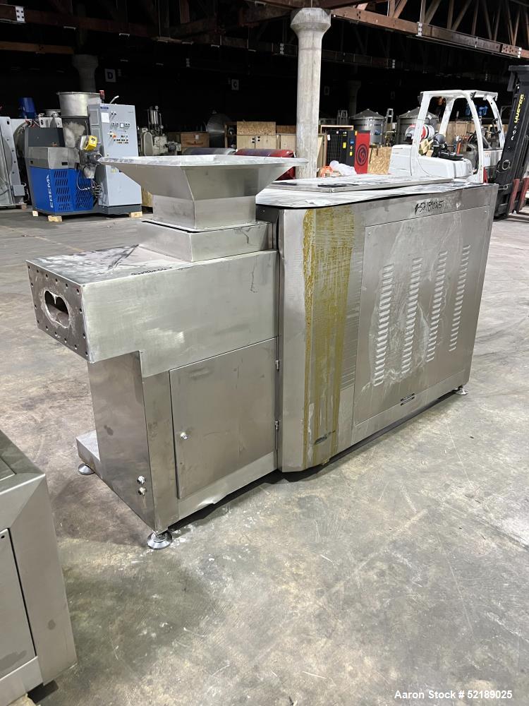 Used Shangha Target 11" Rolling & Scoring Line. Designed to make chiclets. Consisting of: Twin Screw extruder missing screws and die with motor drive, (3) sets of sheeting rollers measuring approxima...