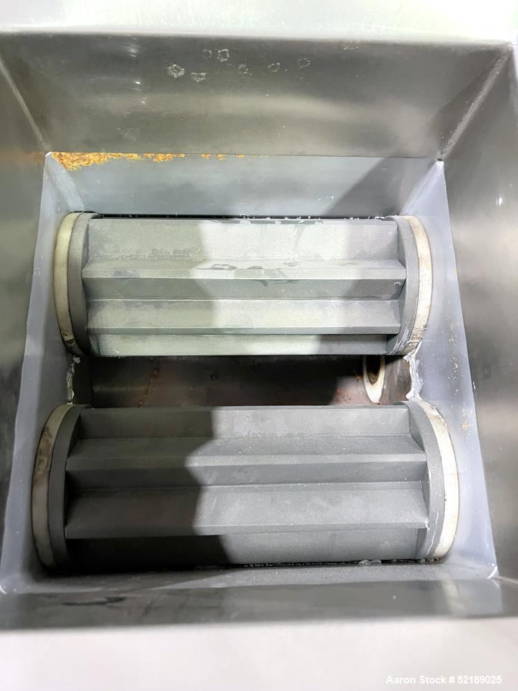 Used Shangha Target 11" Rolling & Scoring Line. Designed to make chiclets. Consisting of: Twin Screw extruder missing screws and die with motor drive, (3) sets of sheeting rollers measuring approxima...