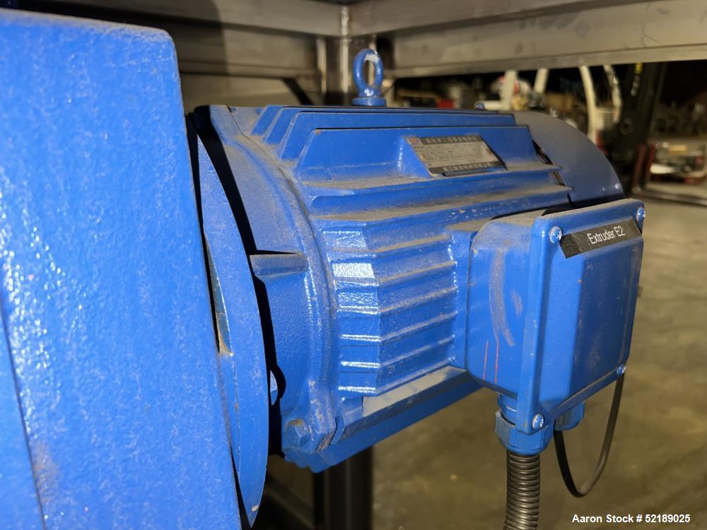 Used Shangha Target 11" Rolling & Scoring Line. Designed to make chiclets. Consisting of: Twin Screw extruder missing screws and die with motor drive, (3) sets of sheeting rollers measuring approxima...