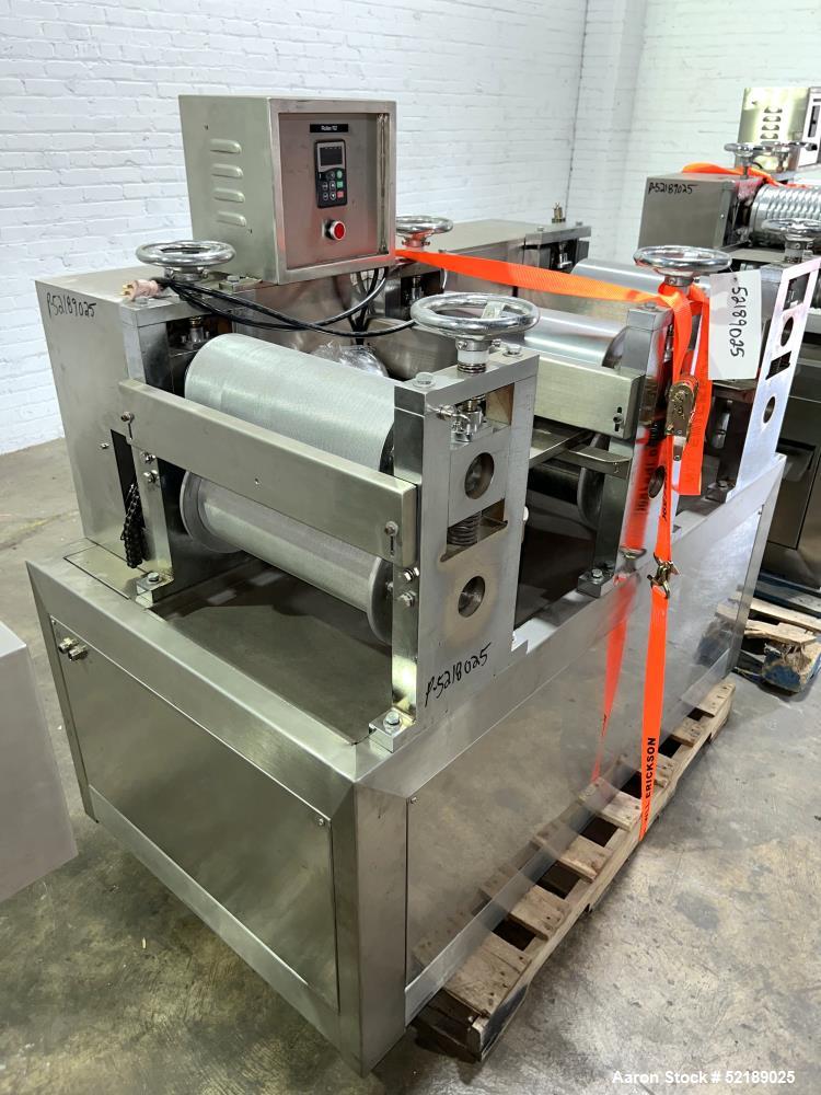Used Shangha Target 11" Rolling & Scoring Line. Designed to make chiclets. Consisting of: Twin Screw extruder missing screws and die with motor drive, (3) sets of sheeting rollers measuring approxima...