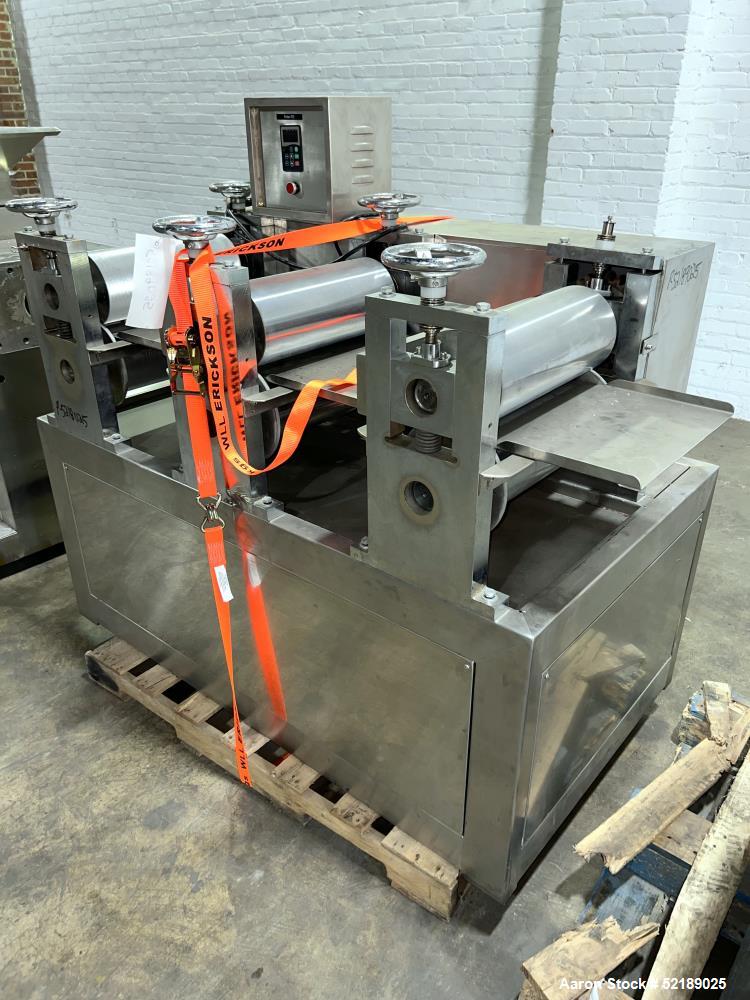 Used Shangha Target 11" Rolling & Scoring Line. Designed to make chiclets. Consisting of: Twin Screw extruder missing screws and die with motor drive, (3) sets of sheeting rollers measuring approxima...